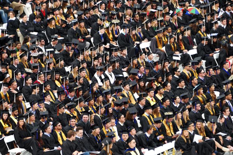 graduates at commencement