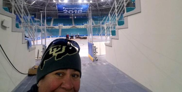 Barb Bogner stands in front of the Olympic Ice Rink in PyeongChang, South Korea