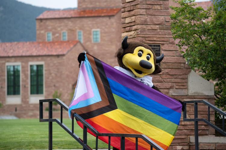Chip holding Pride flag