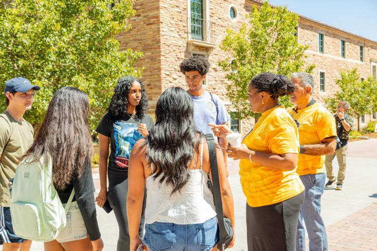 Dr. Mull talking with students