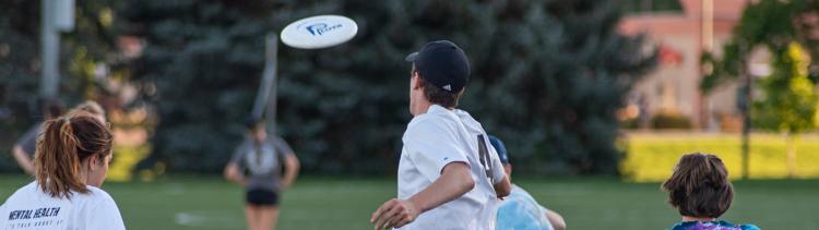 Students playing frisbee