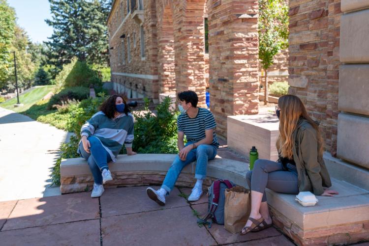 students hanging out on campus