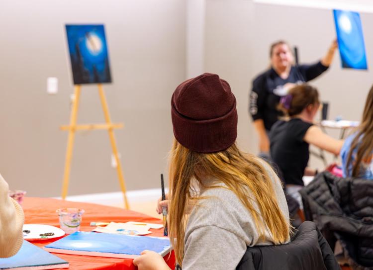 students in guided painting class