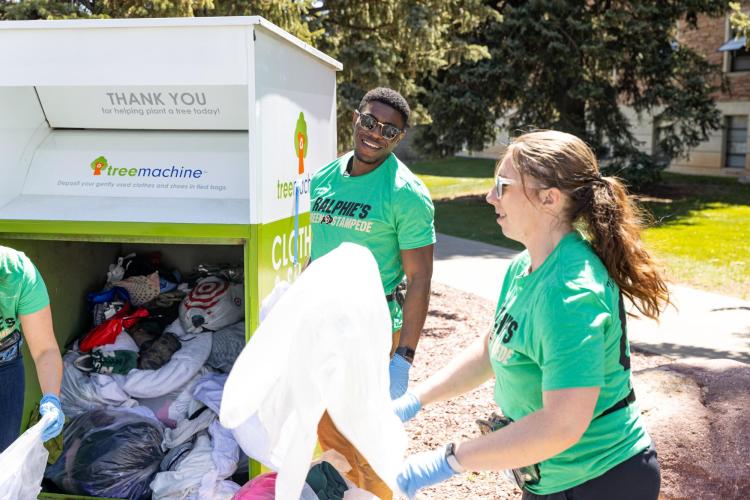 Students helping sort move-out trash