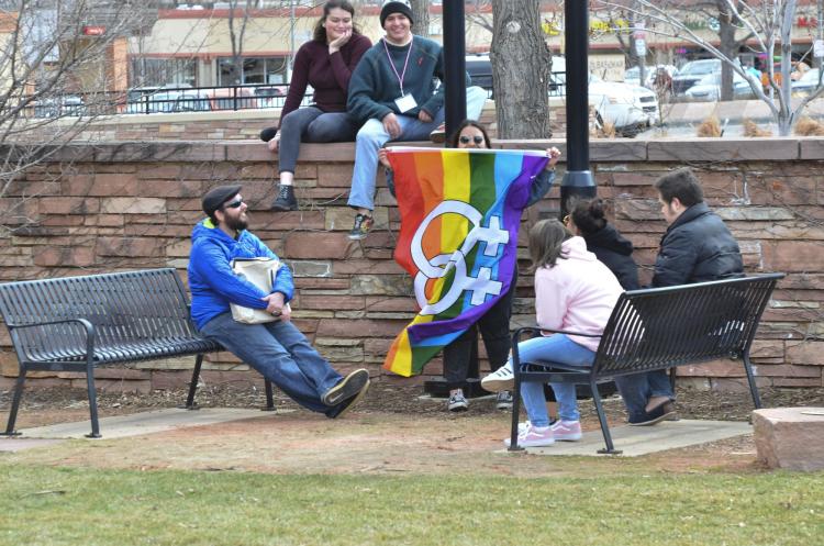 Students with a Pride flag