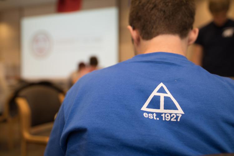 Person wearing a Triangle Fraternity shirt
