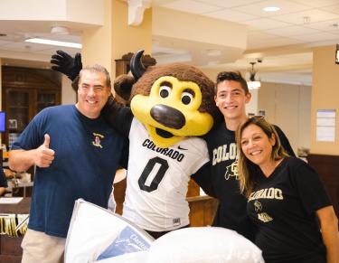 A family posing with Chip