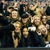 Students cheering at the Buffs football game