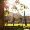 students playing volleyball on campus