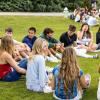 Students sitting outside on campus