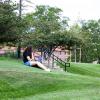 A student sitting outside on the lawn