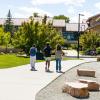 Three students walking on campus