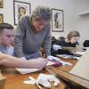 A faculty member works with a student