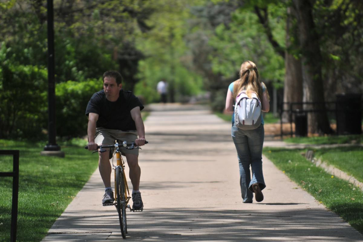 Students walking and biking across campus