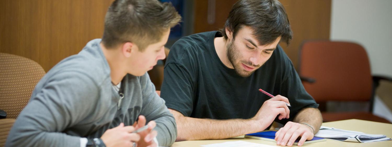 Two males students working together at a table