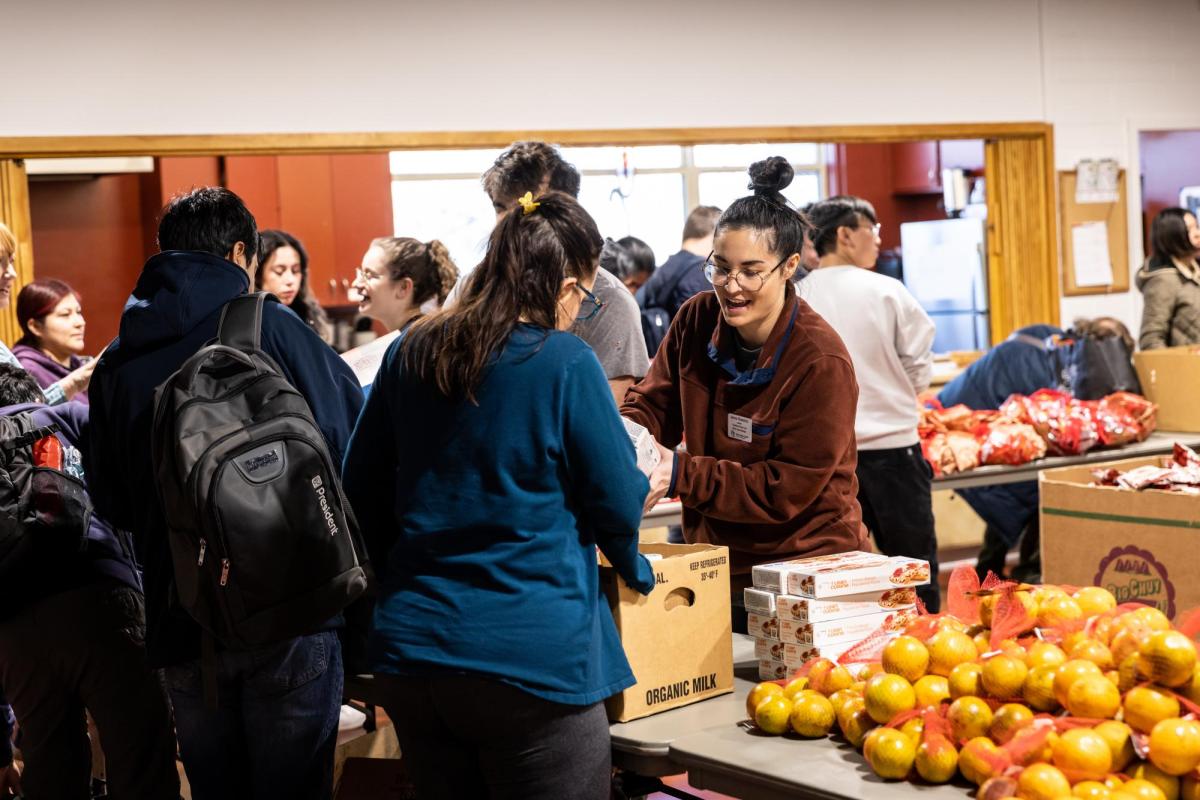 picture of Basic Needs Center volunteers distributing food