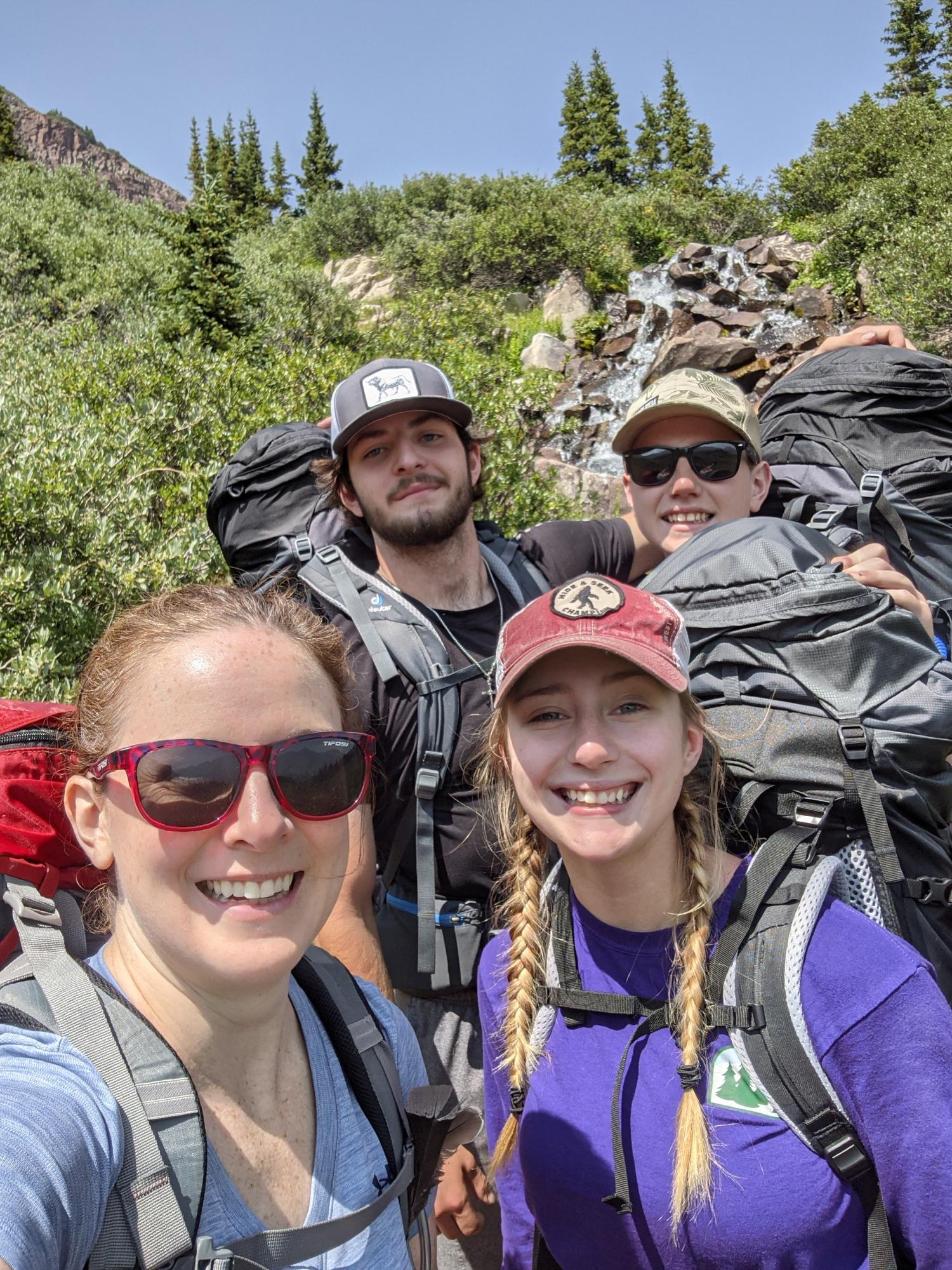 Kellen with her niece and nephews backpacking at Maroon Bells-Snowmass Wilderness.