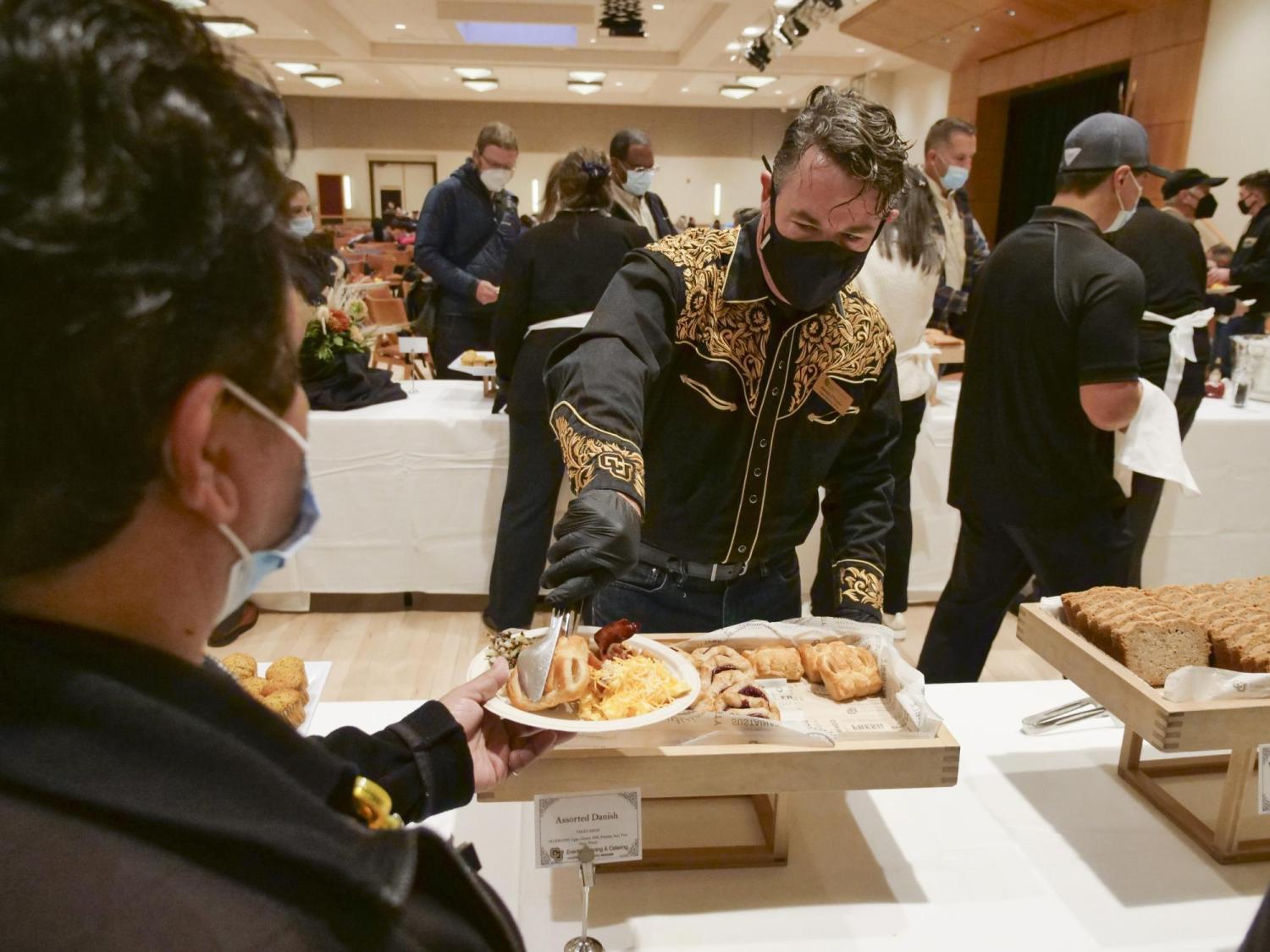 Chief Operating Officer Patrick O’Roarke serves up some breakfast at the Staff Appreciation Breakfast. Photo by Casey A. Cass.