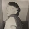 Pat as a kid dressed as a superhero
