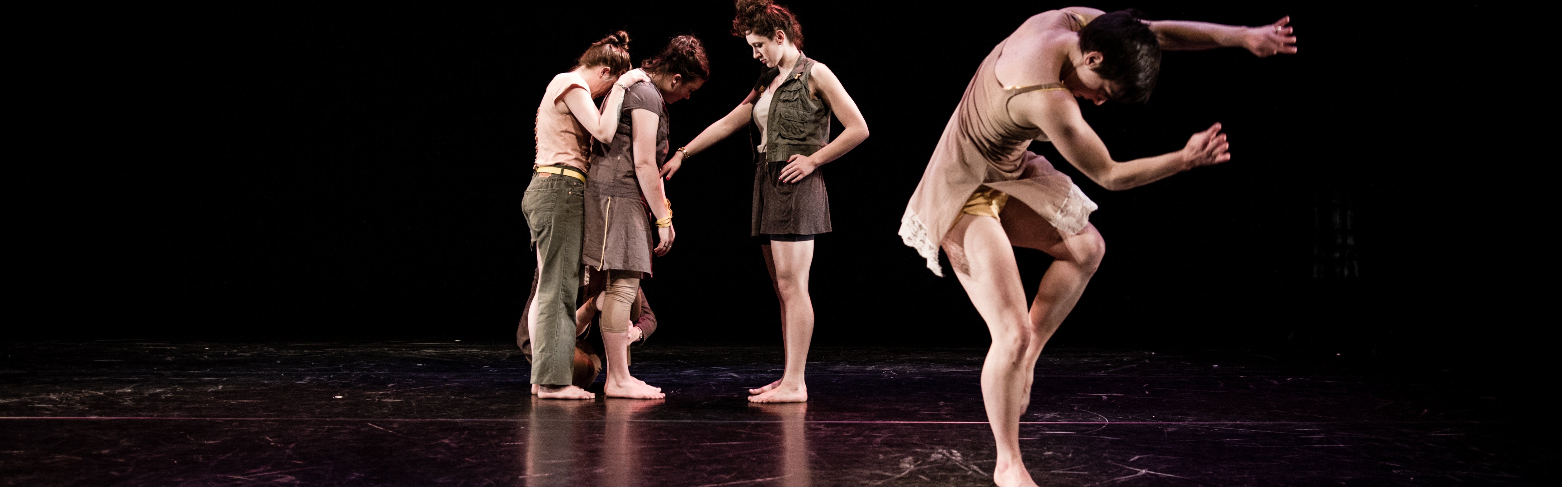Students performing dance on a stage