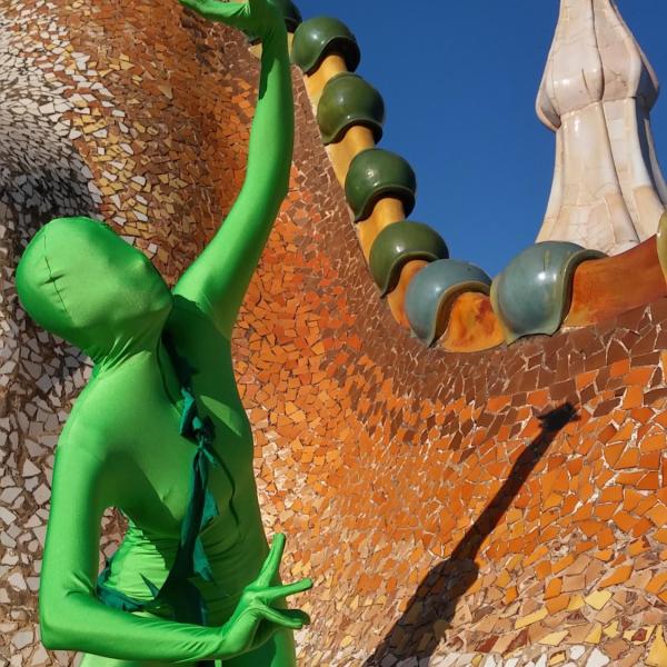 Person in a green suit in Barcelona, Spain