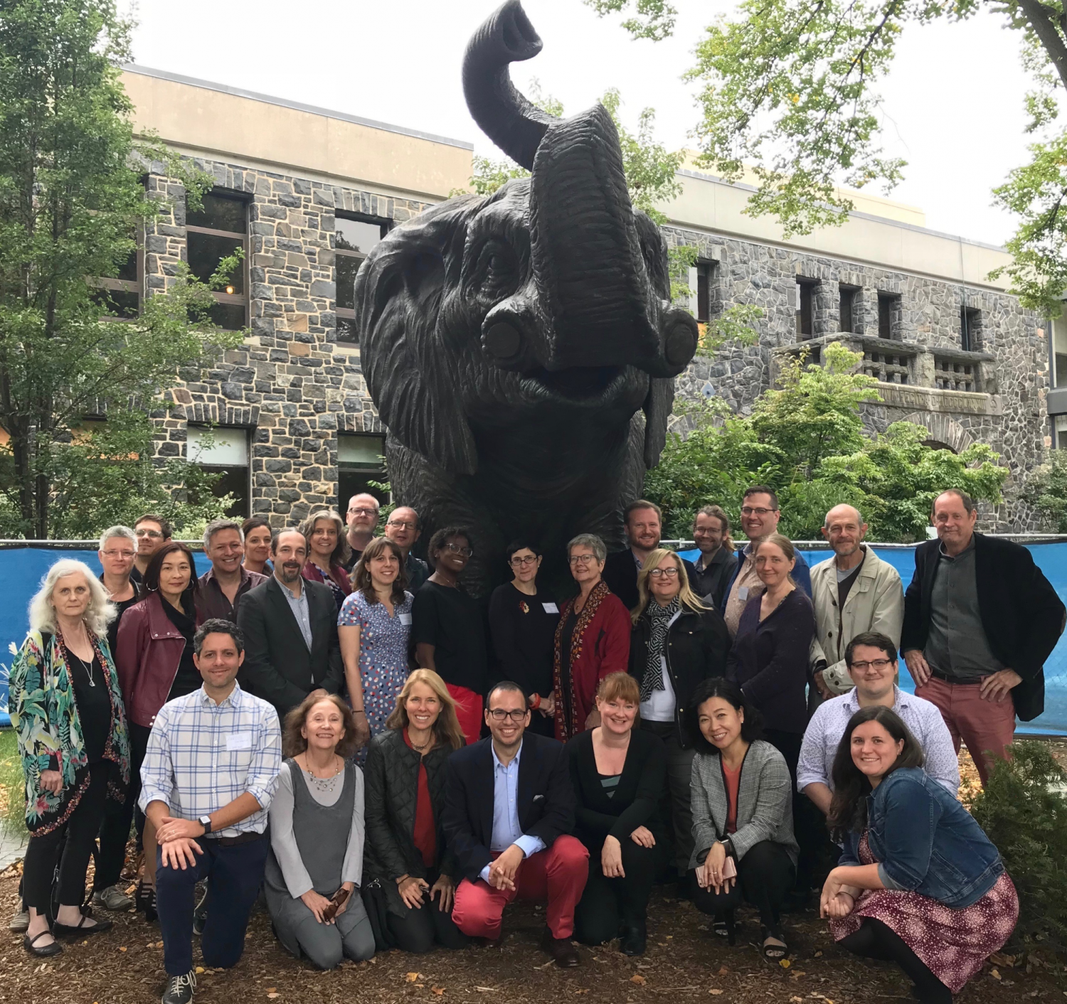 Elephant statue and group of people attending Consortium