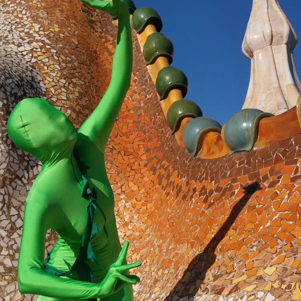 Person in a green suit in Barcelona, Spain