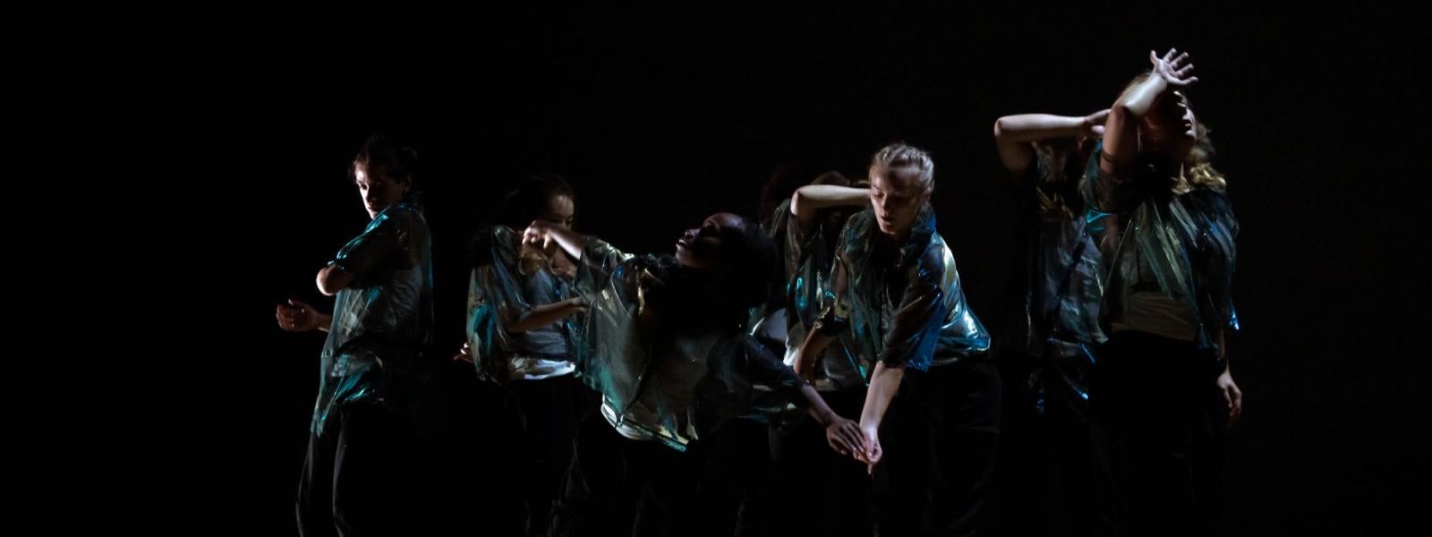 students performing a hip-hop work on stage