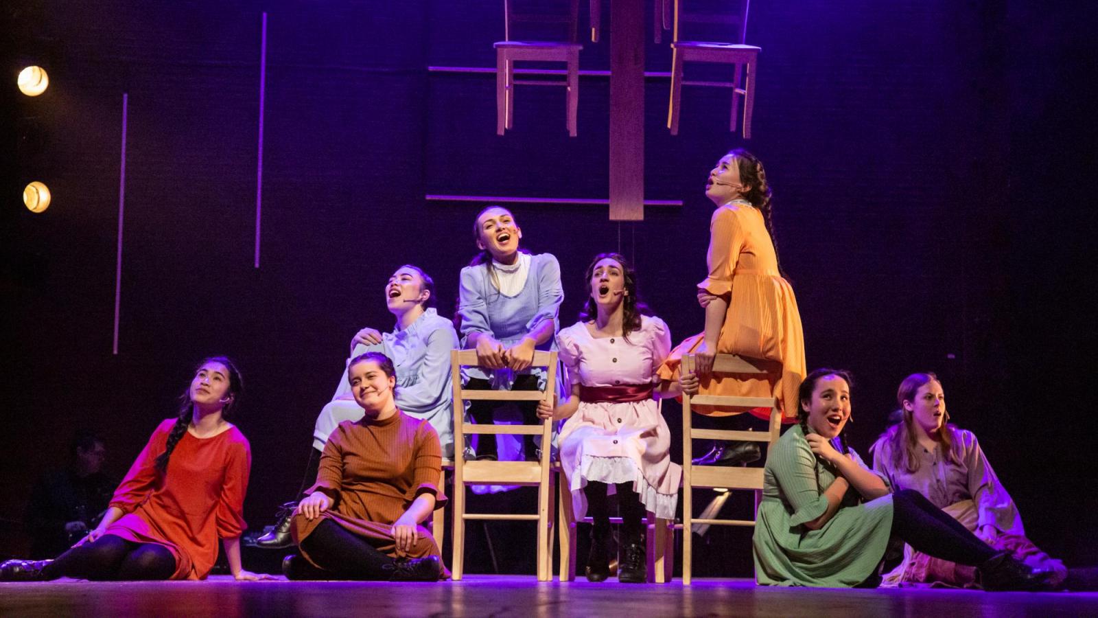A group of women sing together