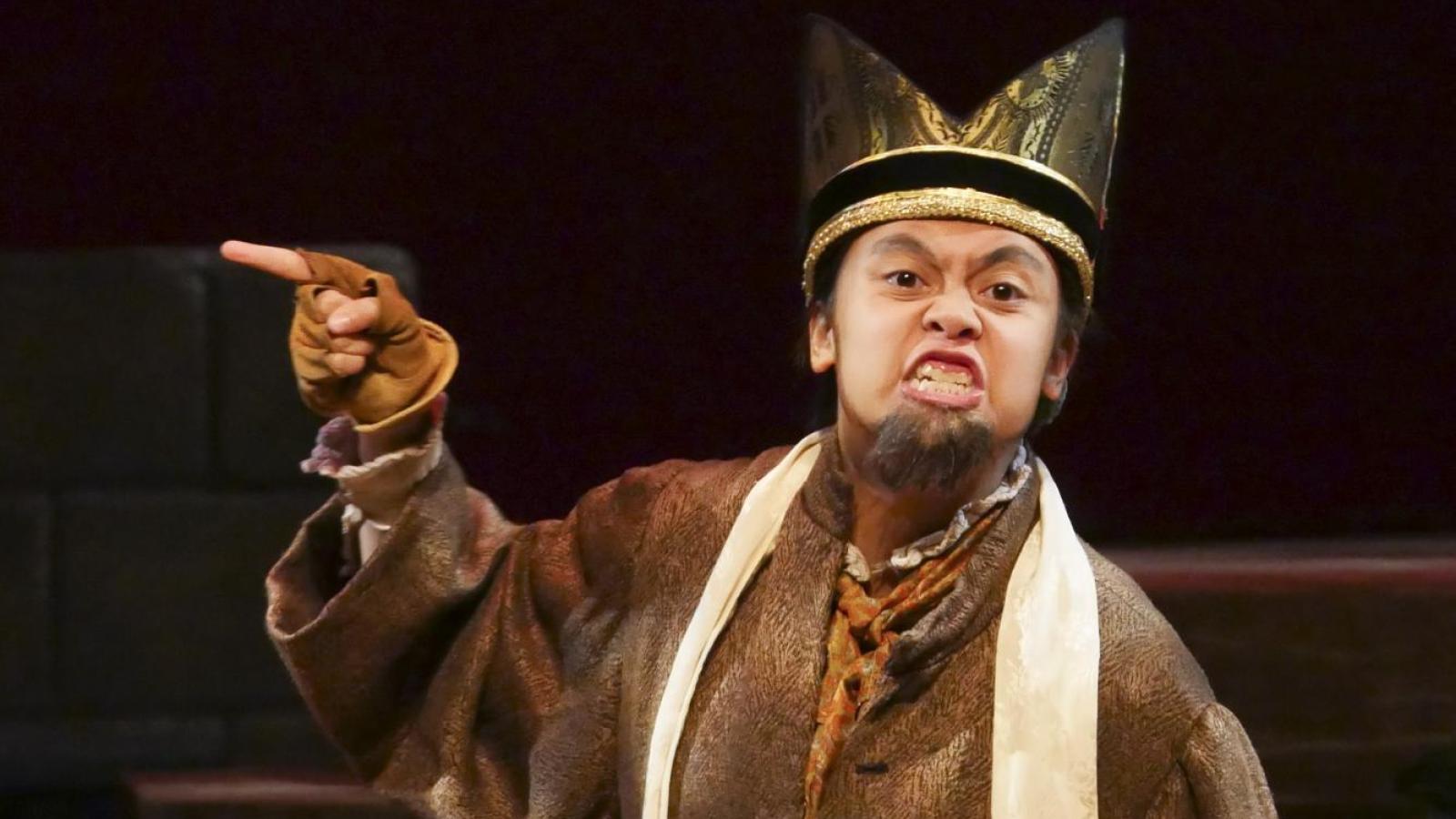 A student actor as Feste (dressed up as Sir Topas), in Twelfth Night