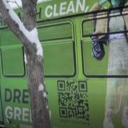 Students model their own green fashions on the sides of RTD buses