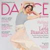 Cover of Dance magazine woman in grey leotard and pink chiffon skirt posing wearing point shoes