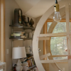 Michelle Ellsworth with a large wooden circular object 
