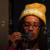 student blowing bubbles