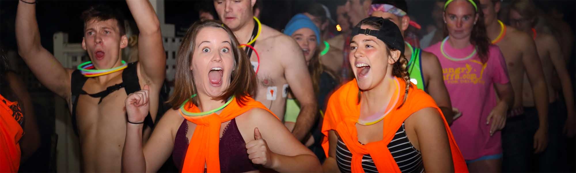 students in bright clothing running in the nearly naked mile