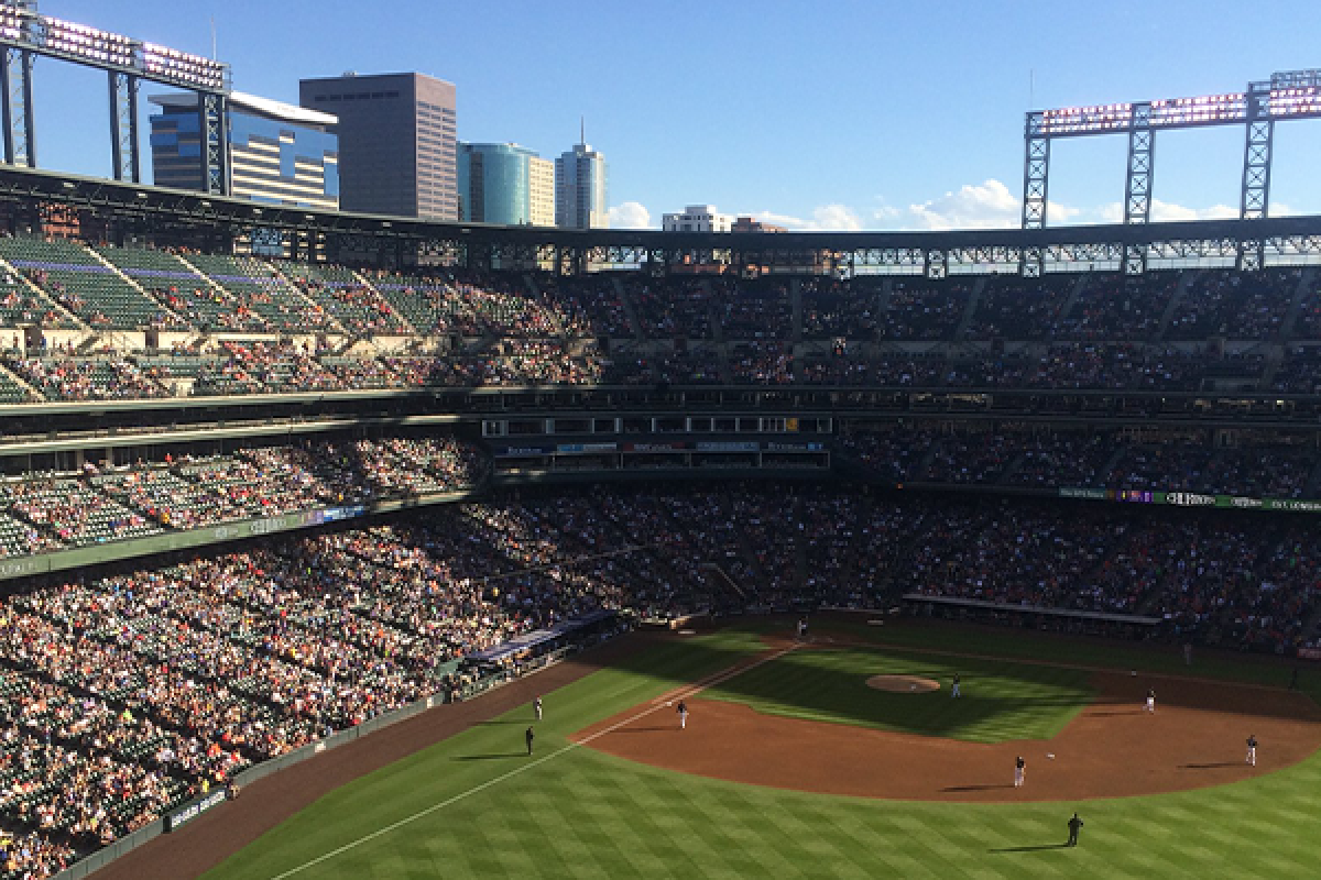 stadium where the rockies play filled with CU students and alumni