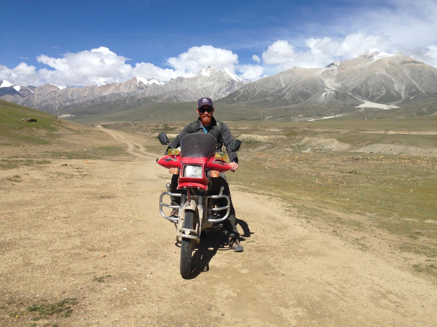 I used motorcycles to reach all three Nepal-China border posts. Here I’m sitting on my friend’s Chinese motorcycle atop the Kora-la