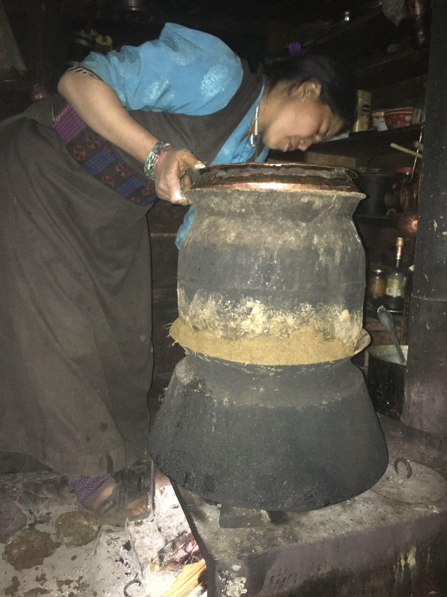 Nangmang Bhuti makes arak (distilled spirits), Tsak village.