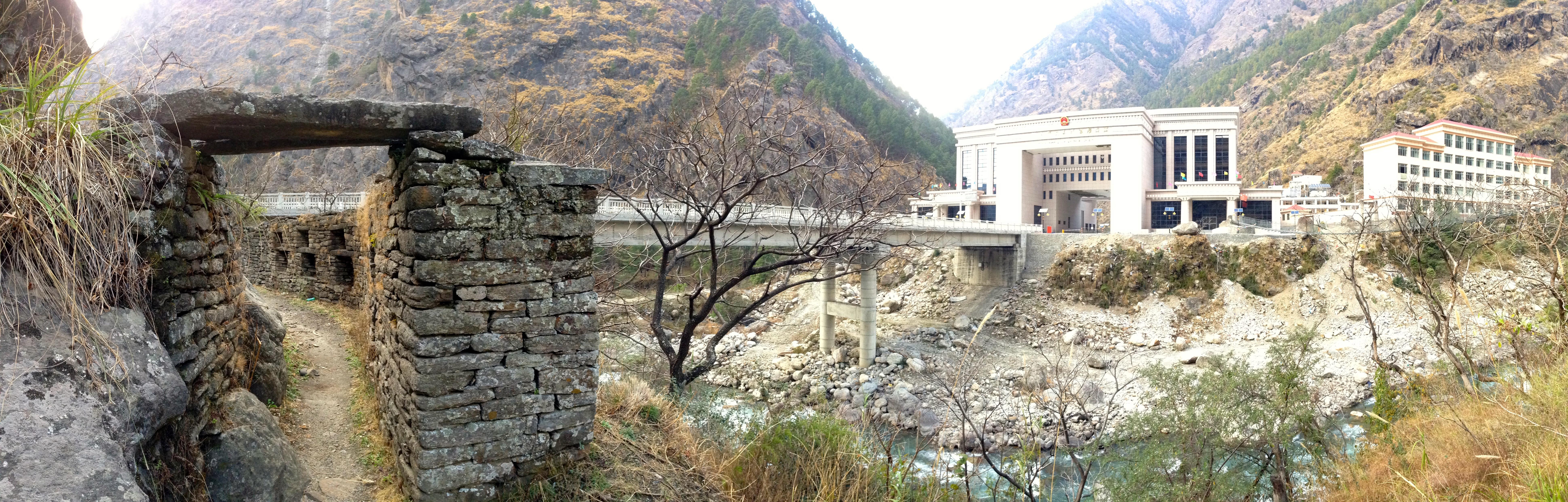 The new Chinese gatehouse looms over the historical Nepali fort at the Kyirong-Rasuwaghadi border