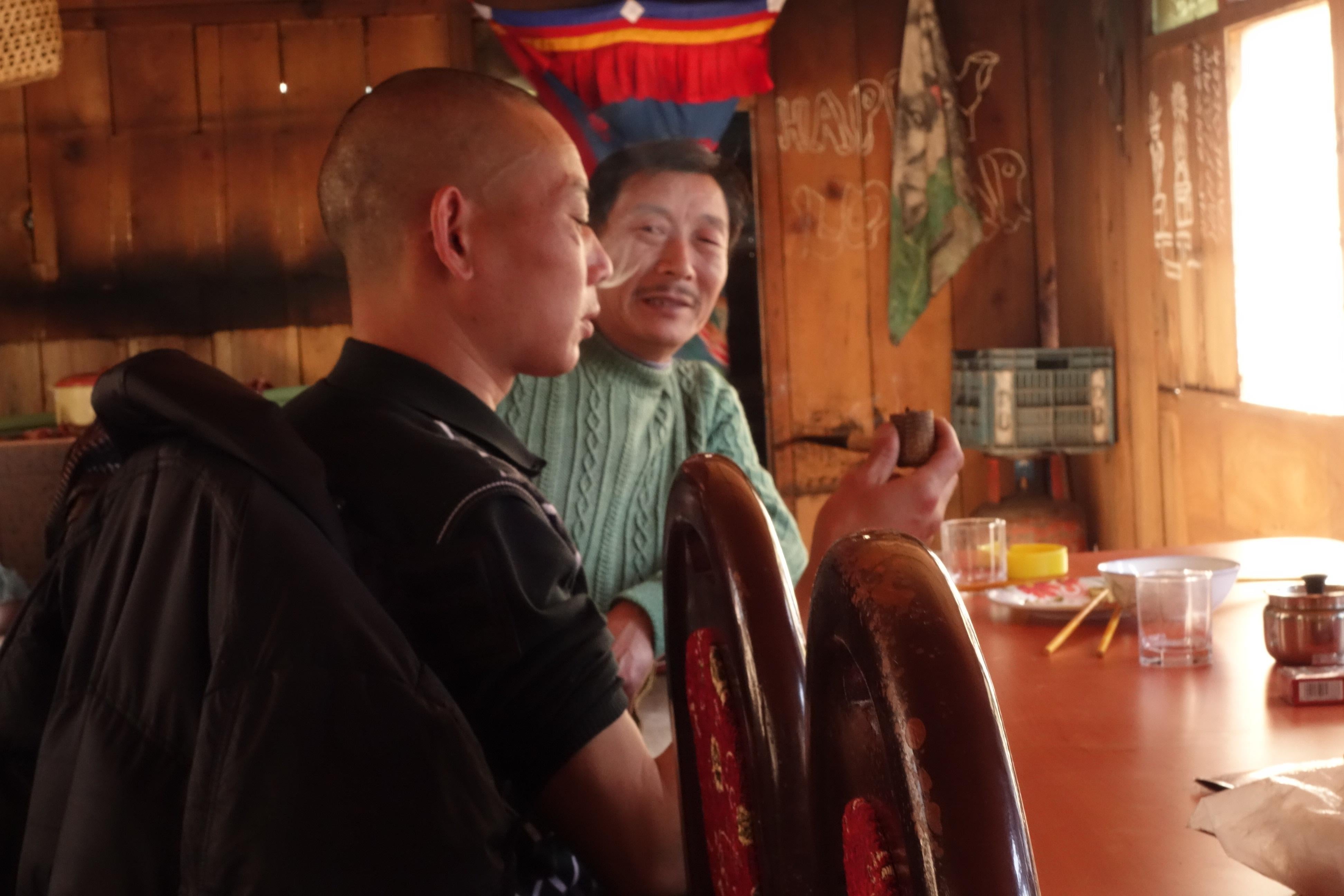 Chinese hydropower workers from Sichuan enjoy Chinese food, Nepali raksi, and American tobacco at the Timure Guest House below Rasuwaghadi