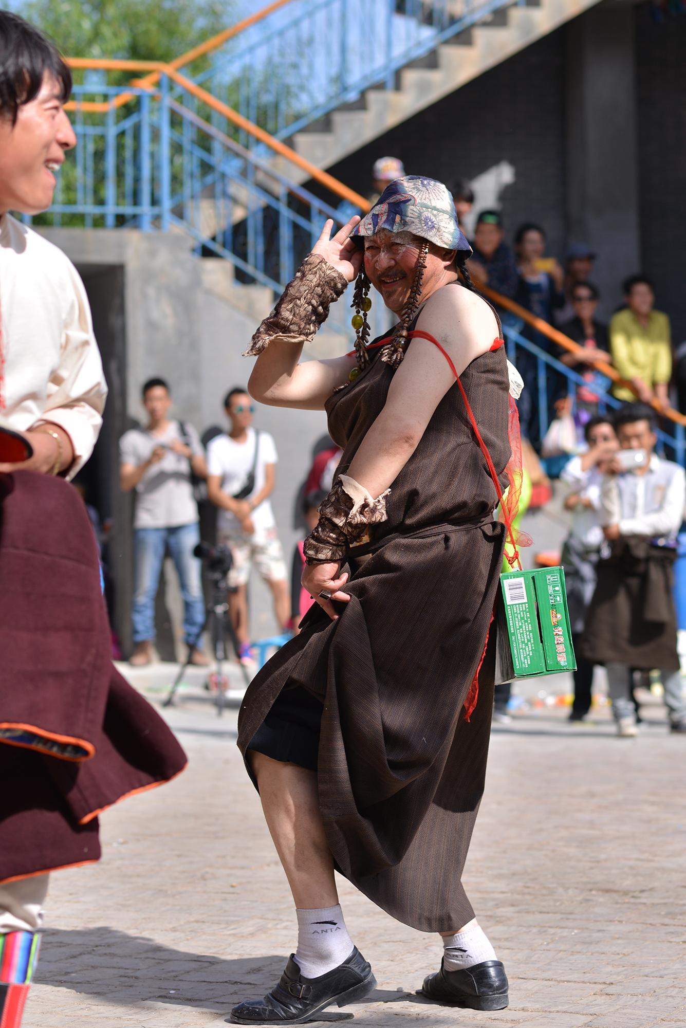 In the comedy portion of the festival, men dress up as women and animals and tell humorous stories. These stories are relevant to current community happenings and have a normative moral dimension.