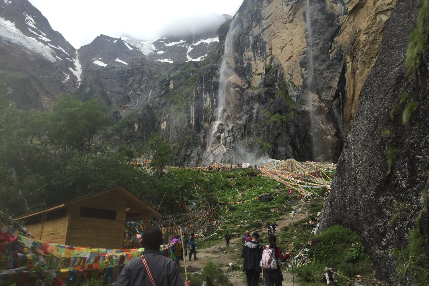 The sacred waterfall (babchu or bsod nams babchu). One of many sayings is that the waterfall distinguishes between those who have accumulated merit, virtue and fortune (bsod nams), who get wet from walking under the water fall during the summer, and those who do not.