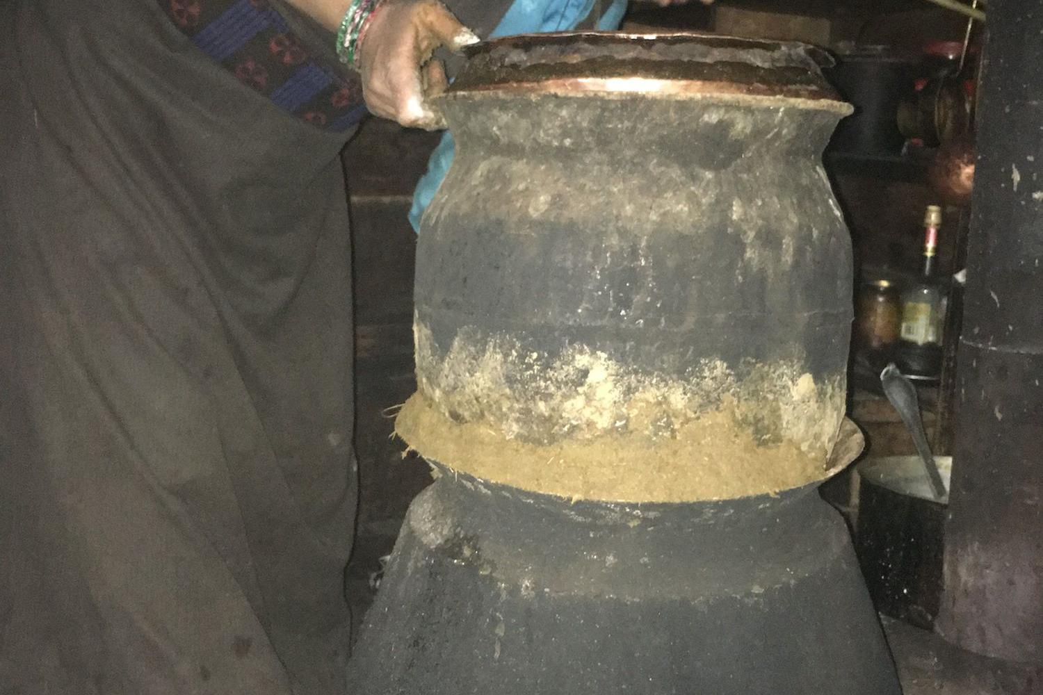 Nangmang Bhuti makes arak (distilled spirits), Tsak village.