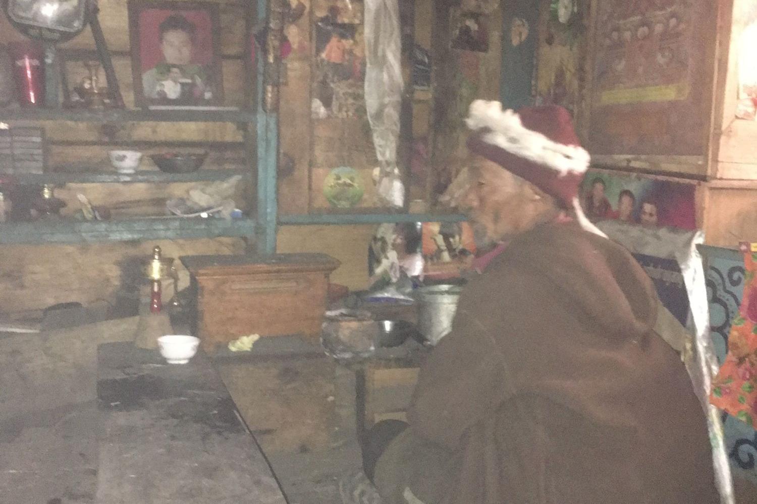 Lama Kunsang Nangsel performs a lhasol (house blessing), Tsak village.