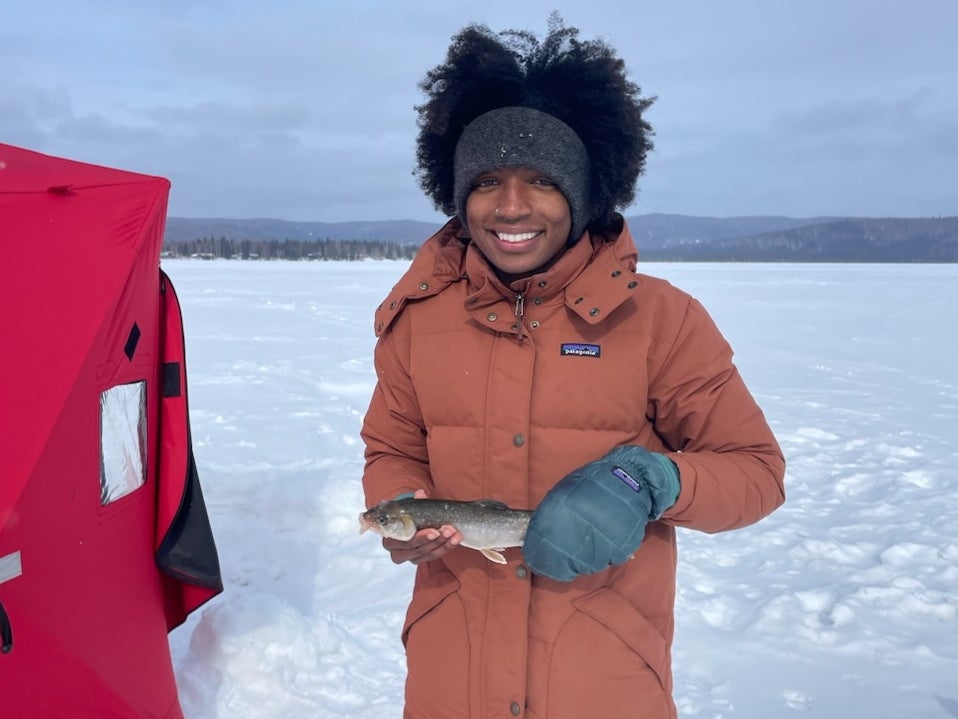 Peyton Thomas holding a fish in Alaska
