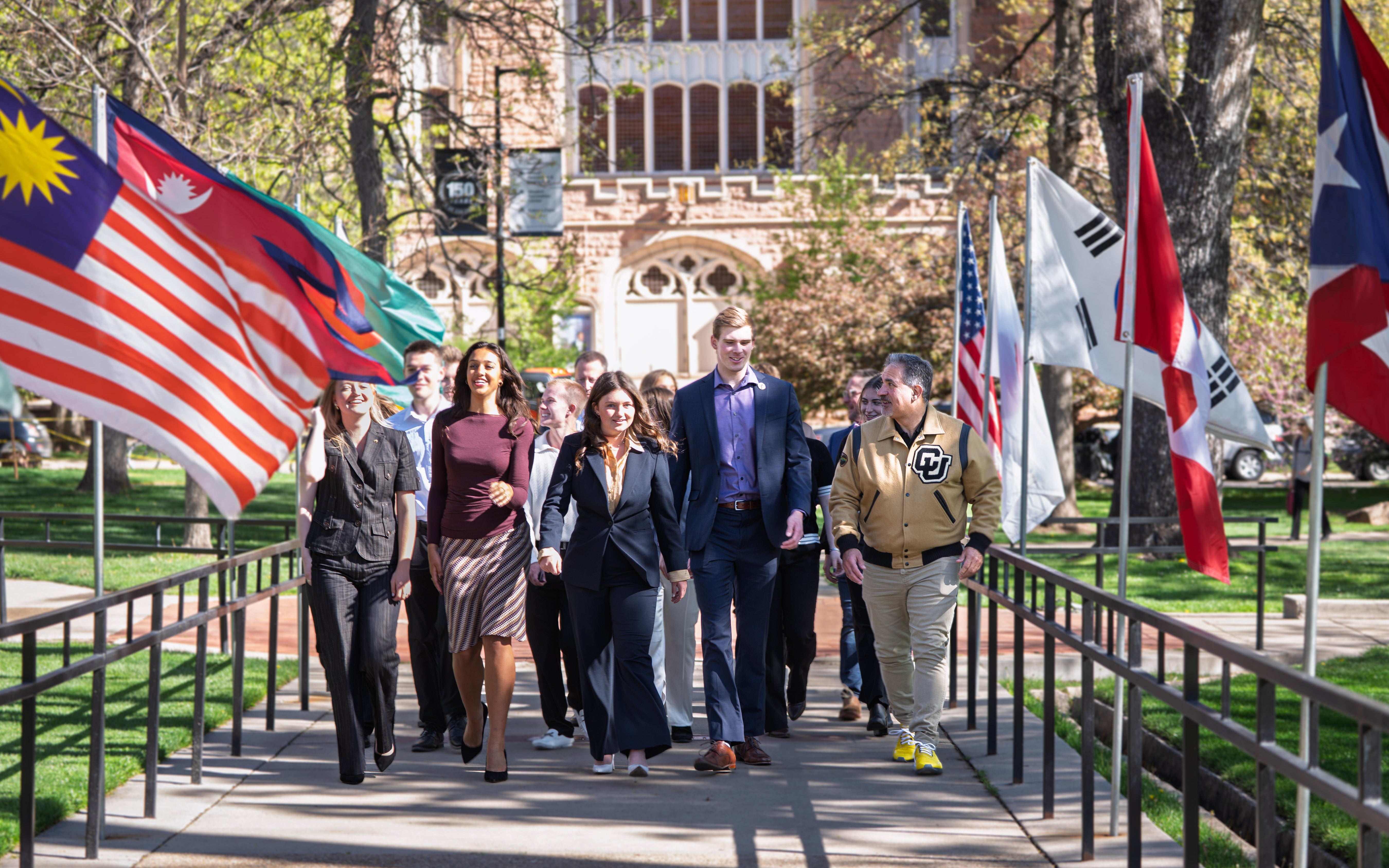 Conference on World Affairs student leadership and volunteers walk with Chancellor Justin Schwartz for the ceremonial procession