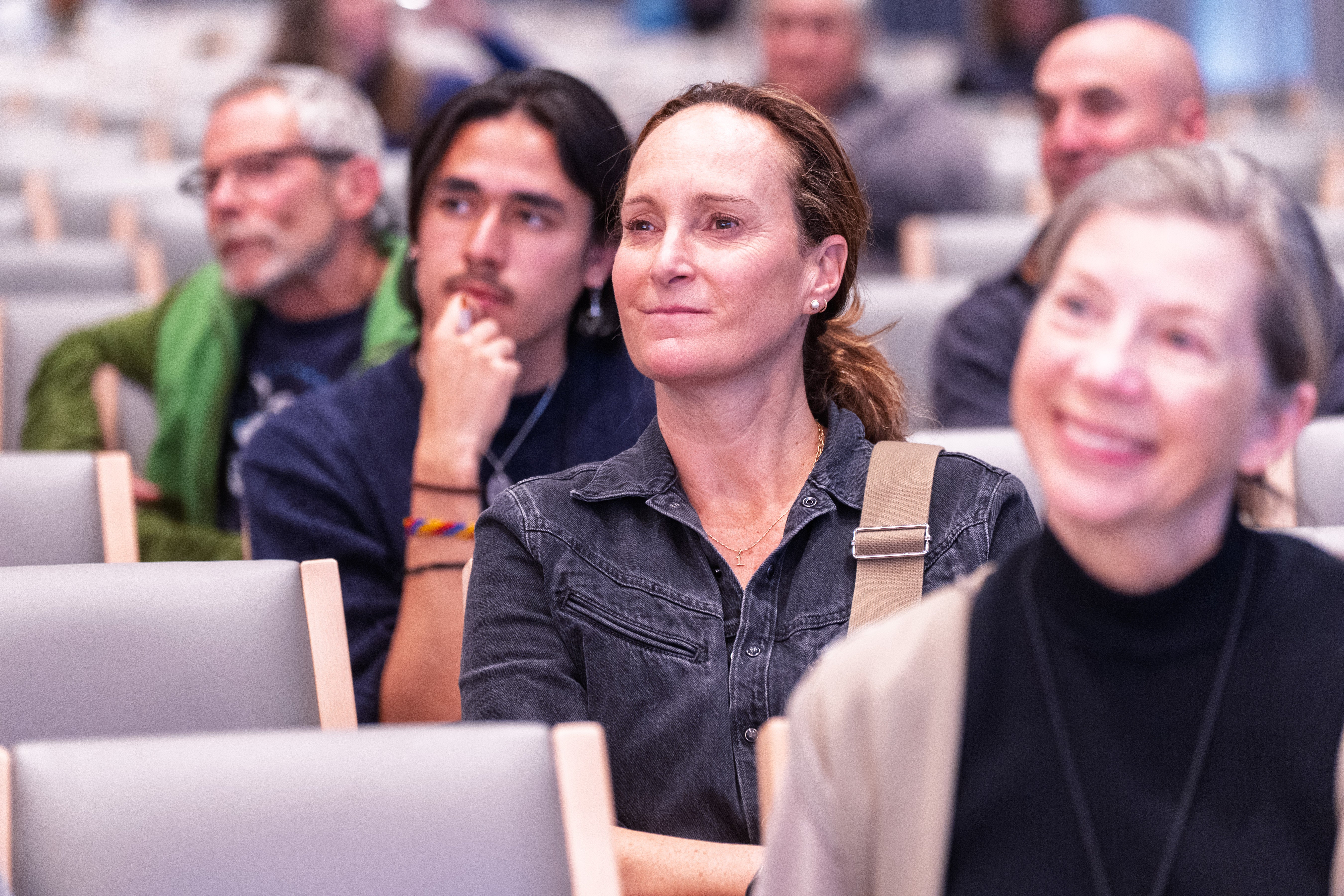 Attendees listen to a panel