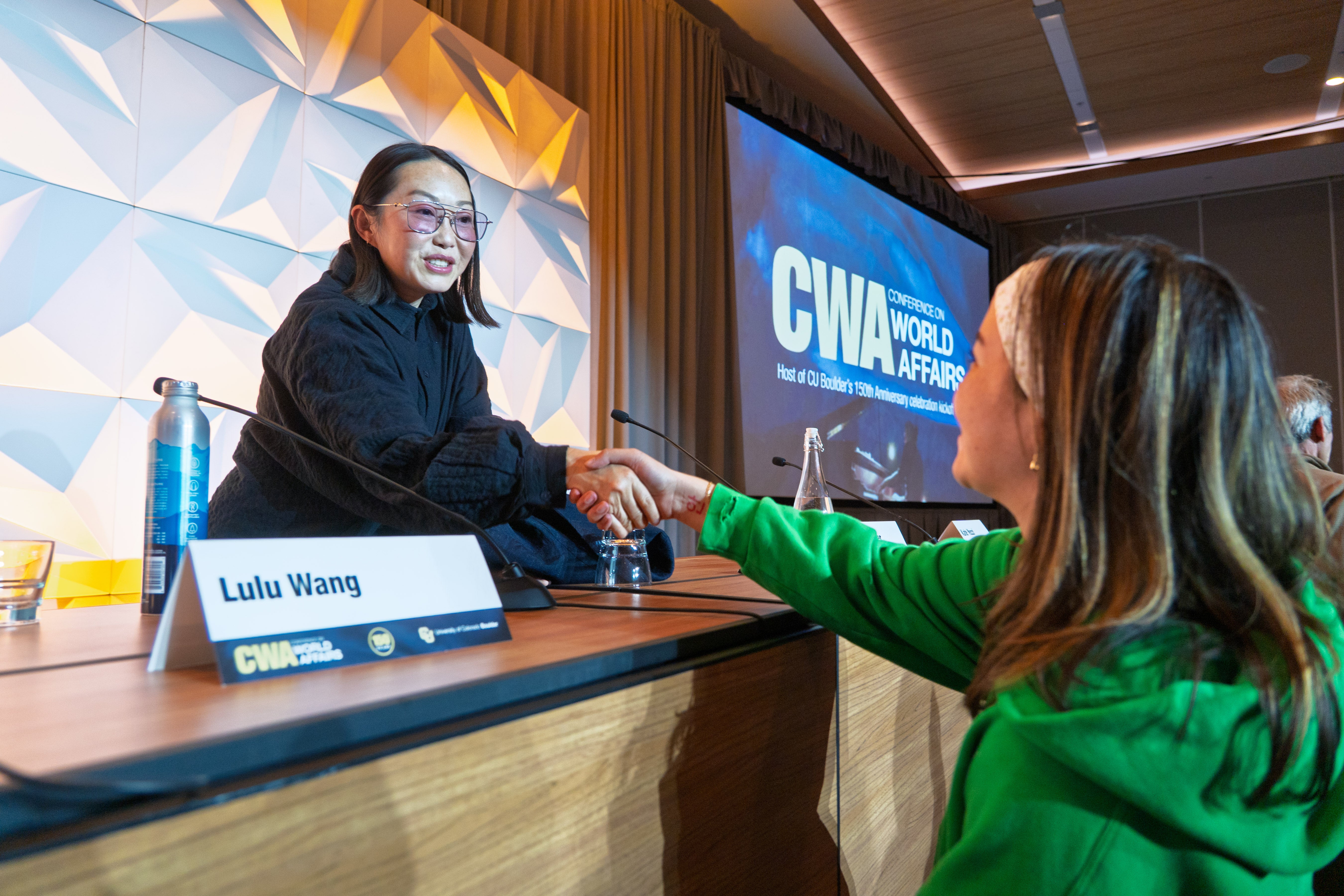 Director Lulu Wang shakes hands with an audience member