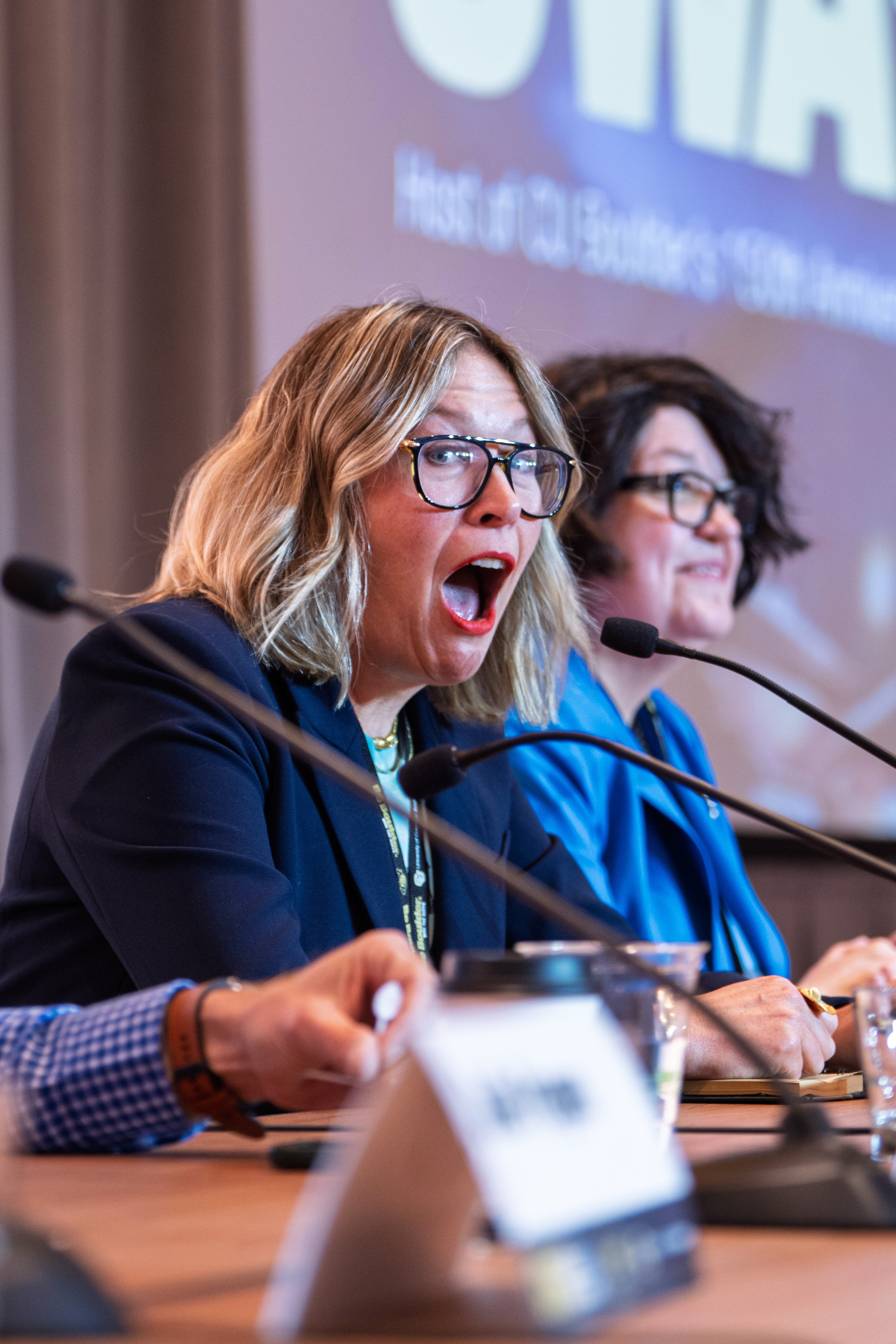Kate Schatz looks surprised during a panel