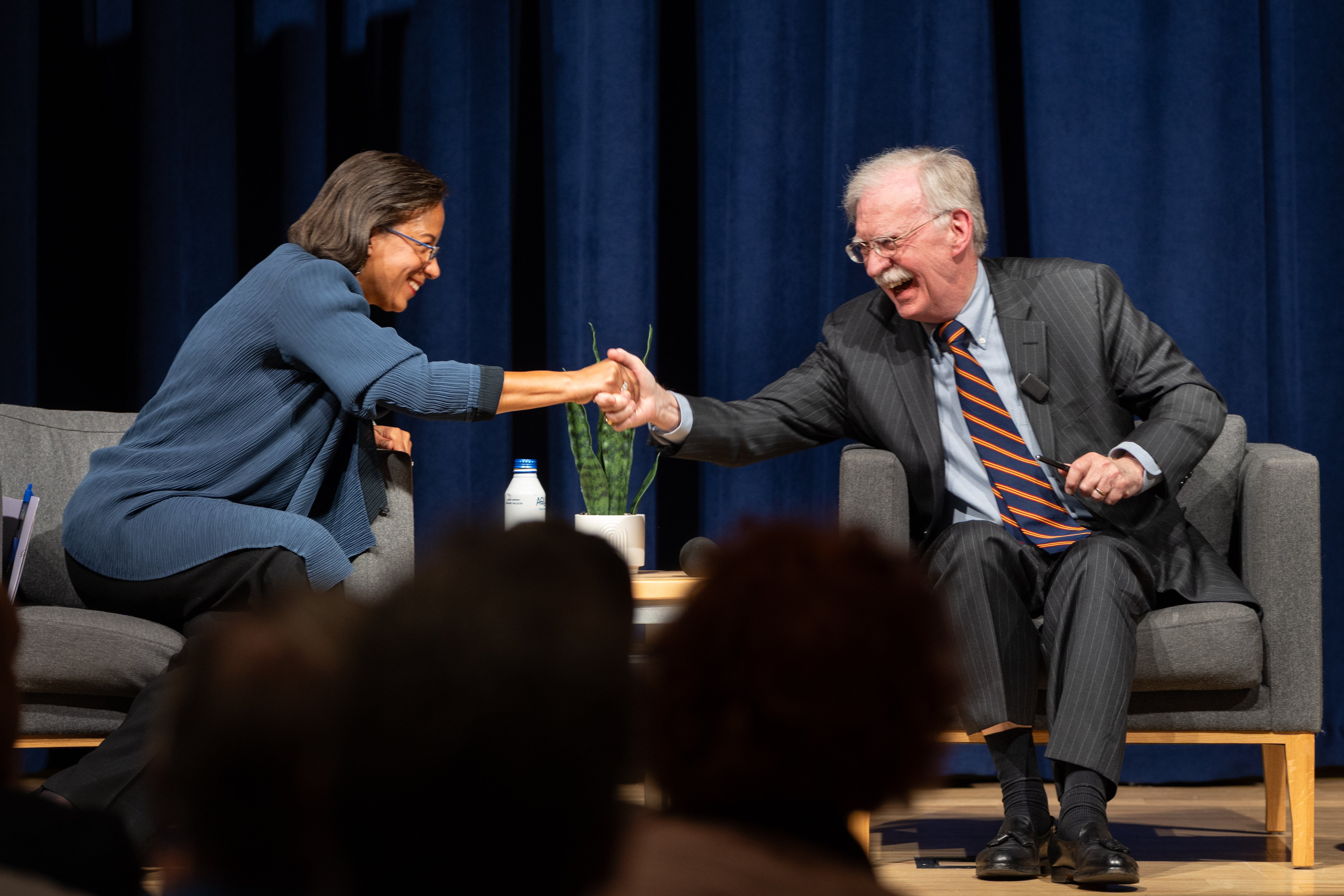 Susan Rice and John Bolton shake hands to kick off the debate